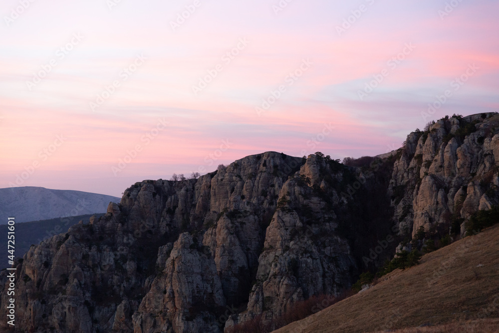 Evening mountain landscape, sunset pink-purple sky of Demerdzhi.