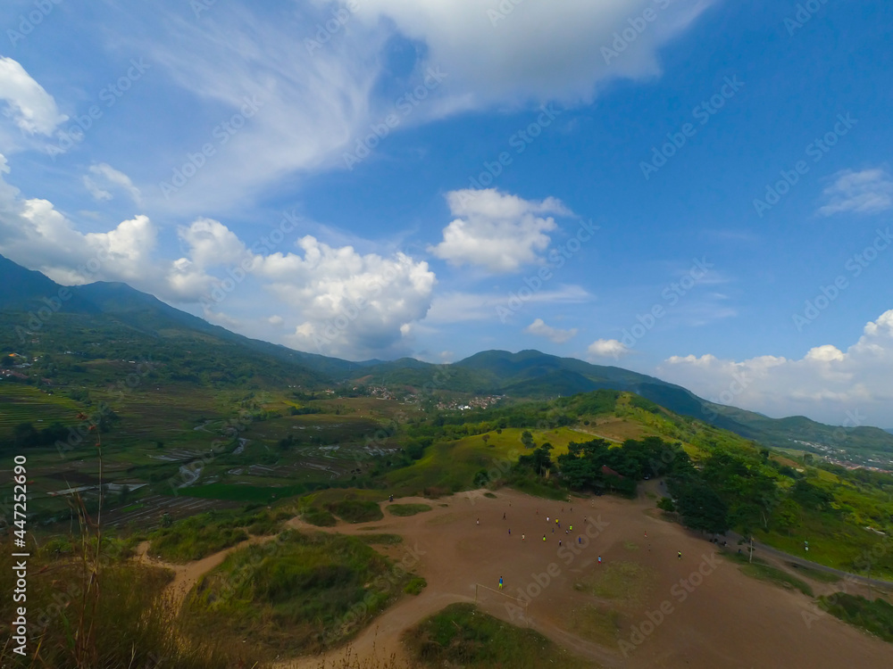 Photos of mountain views, rice fields and fields in the Cicalengka area from the top of the hill