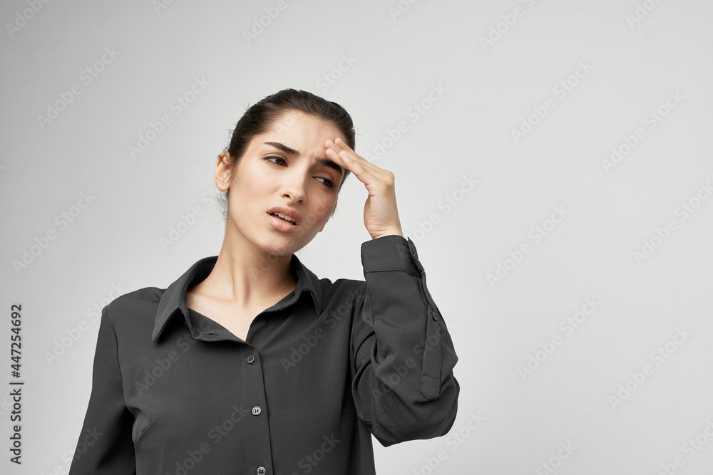 brunette in black shirt holding her head depression health problems lifestyle brunette in black shirt holding her head depression health problems lifestyle