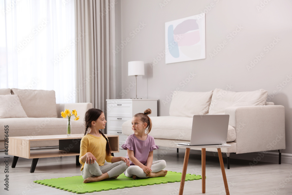 Cute little girls watching online dance class at home Cute little girls watching online dance class at home
