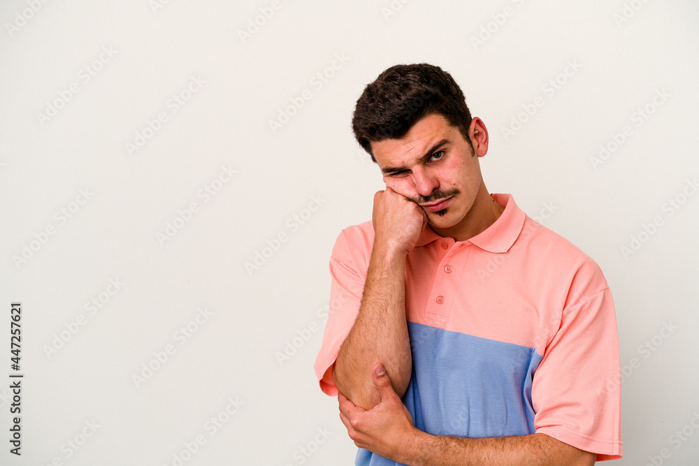 Young caucasian man isolated on white background who feels sad and pensive, looking at copy space. Young caucasian man isolated on white background who feels sad and pensive, looking at copy space.