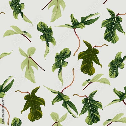 Exotic bright green leaves seamless pattern on light vintage background. 