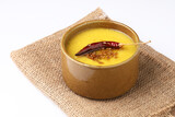 Indian food Yellow lentil soup or yellow dal or Tur dal with red chilli and jeera tadka 