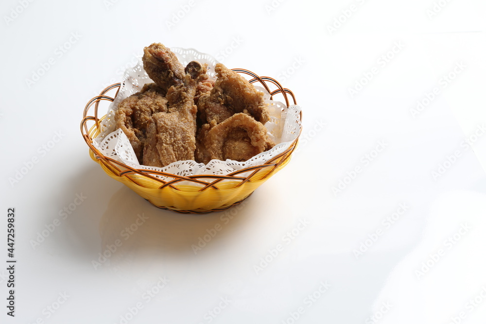 deep fried crispy chicken meat in basket in white black background dim sum snack halal menu deep fried crispy chicken meat in basket in white black background dim sum snack halal menu