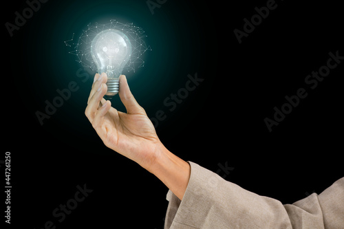 Woman Hands holding light bulb - symbols of idea, creative thinking, innovations and intelligence.