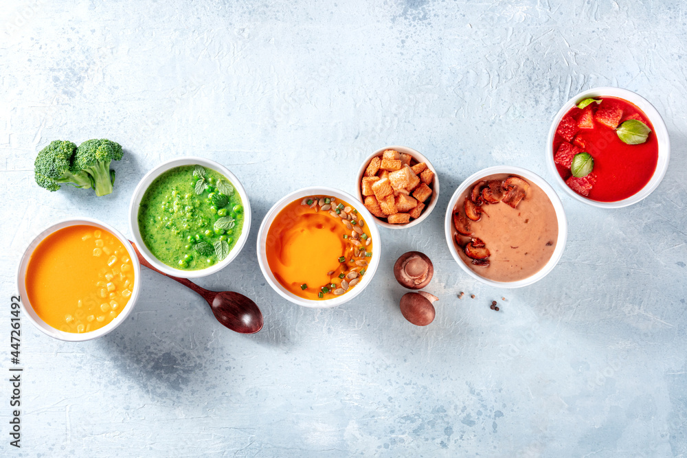 Vegan soup assortment, a flat lay composition. Healthy vegetable detox diet, shot from the top with a place for text Vegan soup assortment, a flat lay composition. Healthy vegetable detox diet, shot from the top with a place for text