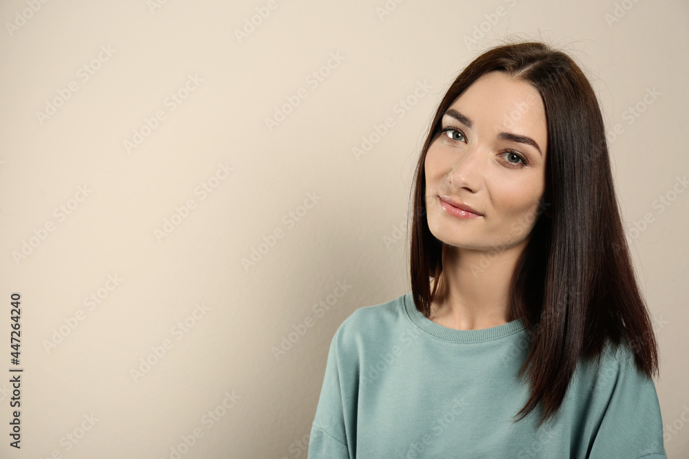 Portrait of pretty young woman with gorgeous chestnut hair on light background, space for text Portrait of pretty young woman with gorgeous chestnut hair on light background, space for text