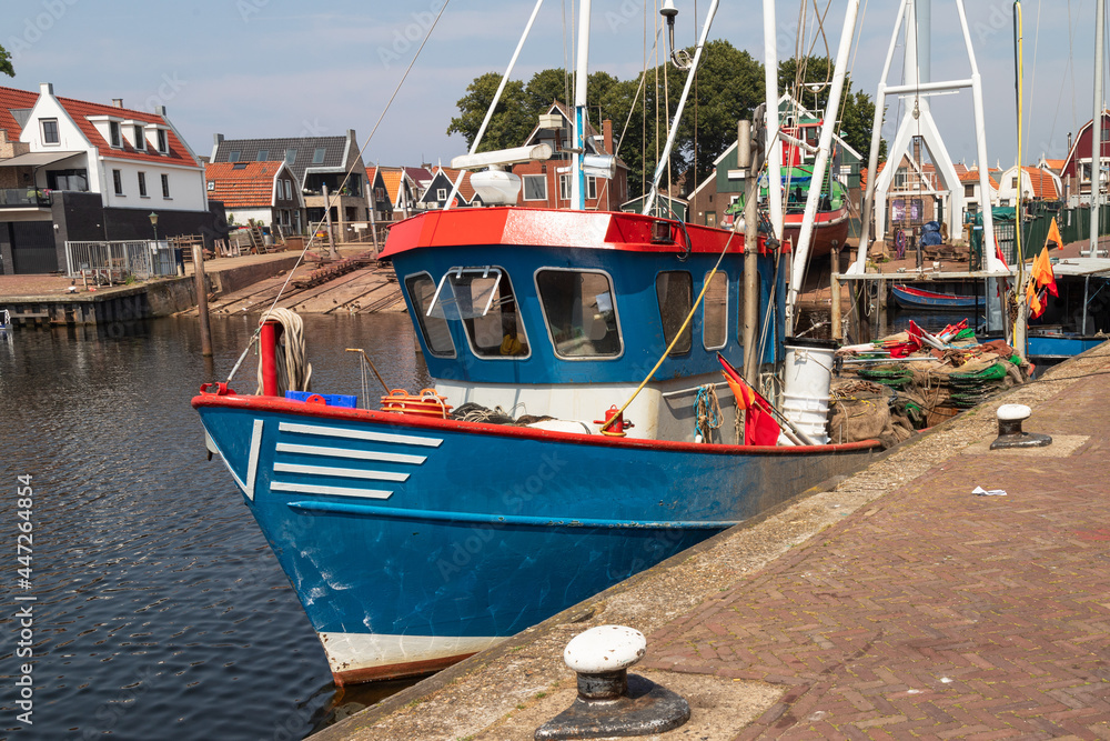 Fishing boat with nets in the harbor of the fishing village of Urk.