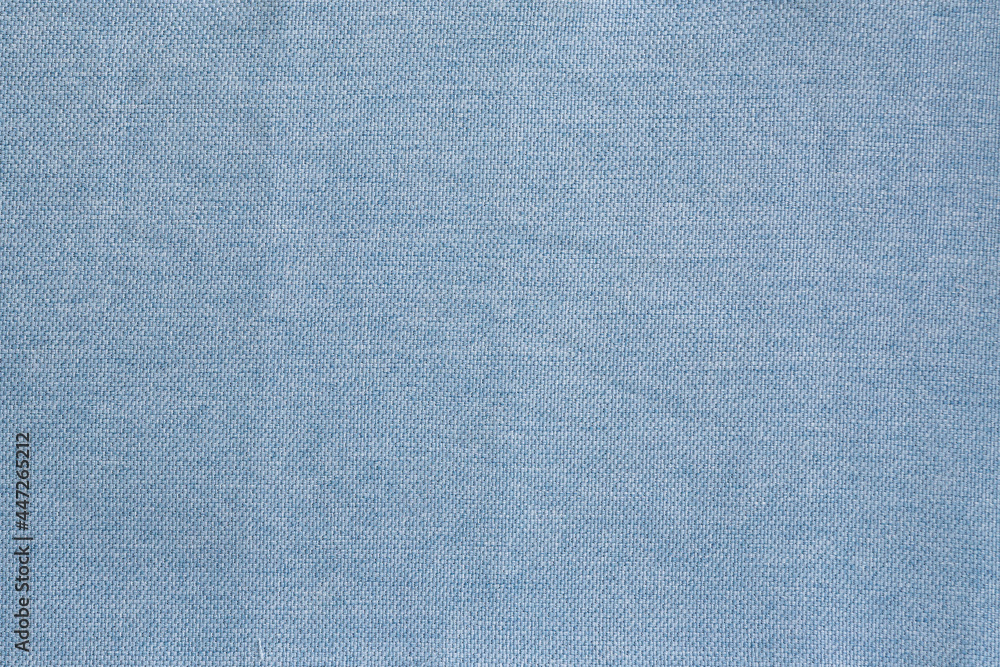 Textured texture of blue curtain fabric with coarse thread Textured texture of blue curtain fabric with coarse thread
