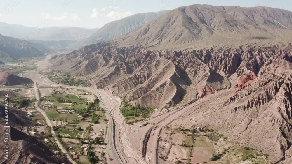 Dlog flat aerial drone view of Hill of Seven Colors in Jujuy, Purmamarca, Argentina Cerro de los Siete Colores