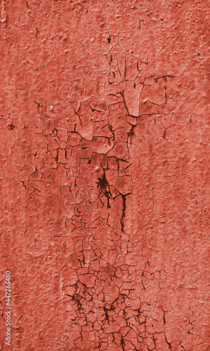 Texture of rough painted terracotta wall cracked from time