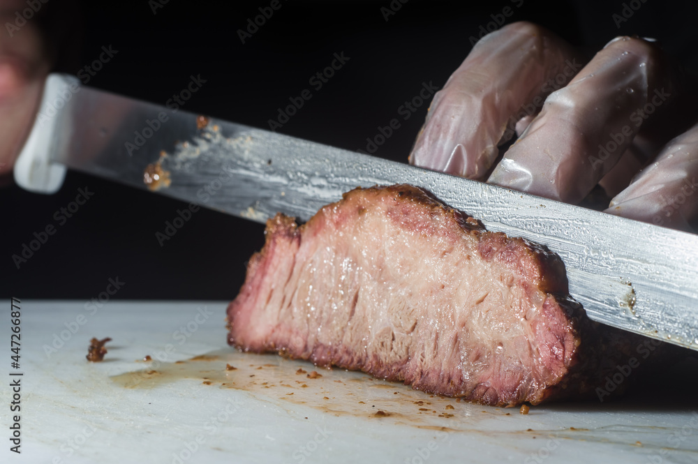 hump steak being sliced ​​with copy space