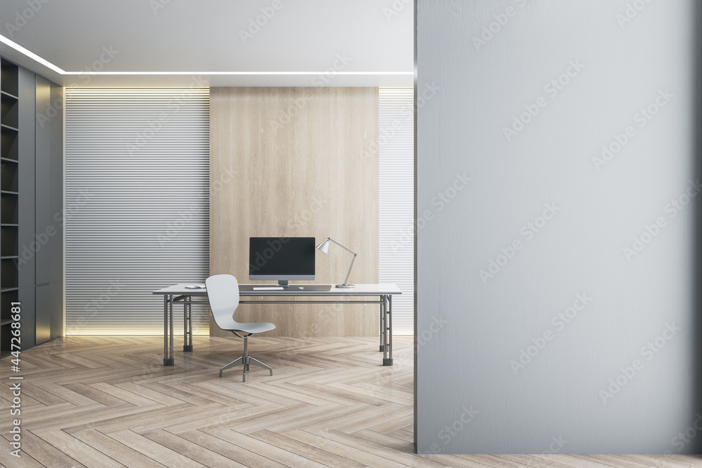 Fototapeta premium Desk with empty black computer monitor in modern white office interior with daylight, wooden flooring and empty mockup place on wall. Mock up, 3D Rendering.