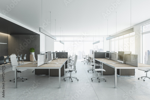 Stylish coworking office with modern workspaces  white chairs  concrete floor  meeting area and city view from huge window