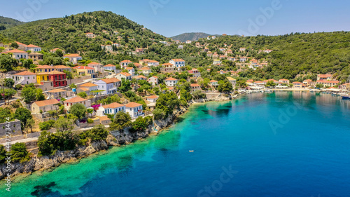 Fototapeta Naklejka Na Ścianę i Meble -  Aerial view of the cliff side of the Kioni village in Ithaca during the pandemic summer of 2020
