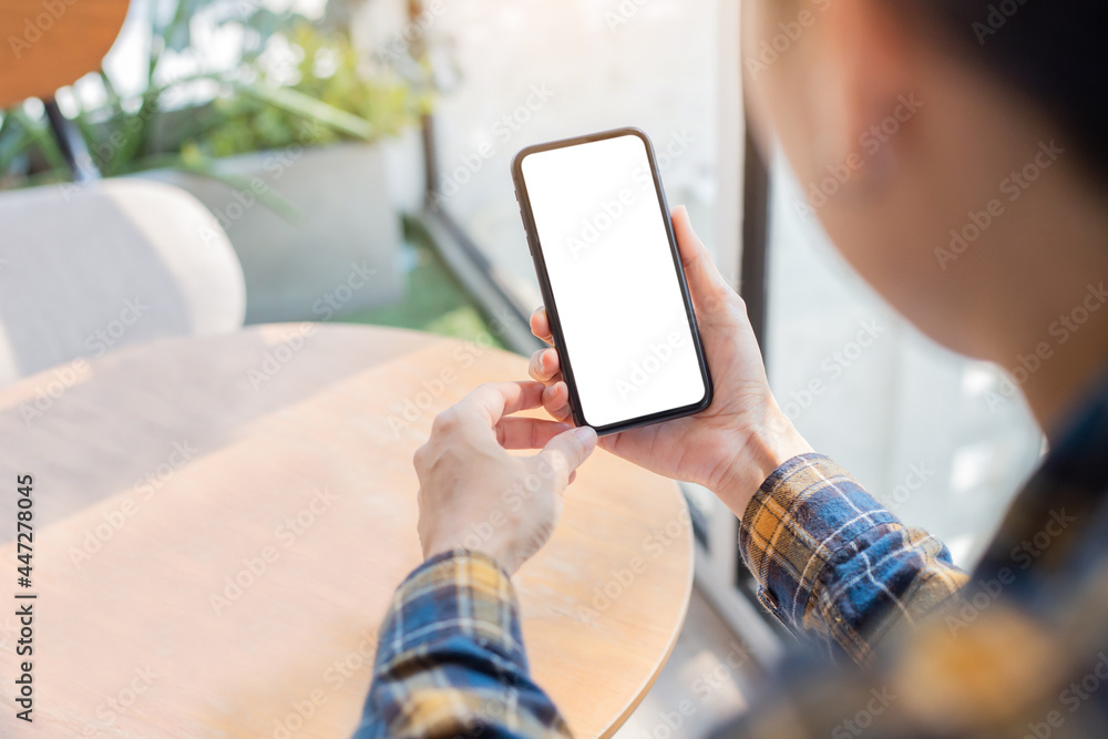 cell phone blank white screen mockup.woman hand holding texting using mobile on desk at office.background empty space for advertise.work people contact marketing business,technology cell phone blank white screen mockup.woman hand holding texting using mobile on desk at office.background empty space for advertise.work people contact marketing business,technology