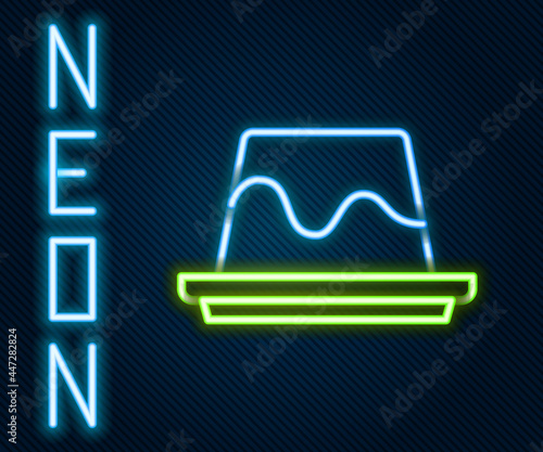 Glowing neon line Pudding custard with caramel glaze icon isolated on black background. Colorful outline concept. Vector