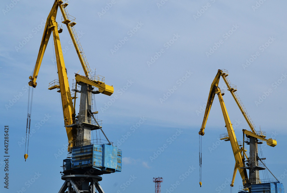 Cranes construction on the blue sky Cranes construction on the blue sky