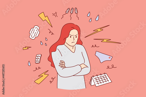PMS and premenstrual syndrome concept. Young irritated Woman cartoon character standing suffering from premenstrual syndrome with sanitary pads and tampons around  photo