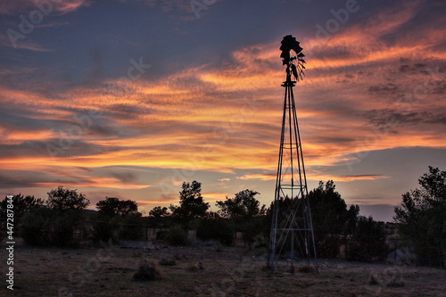 Windmill at sunset near Alpine Texas photo