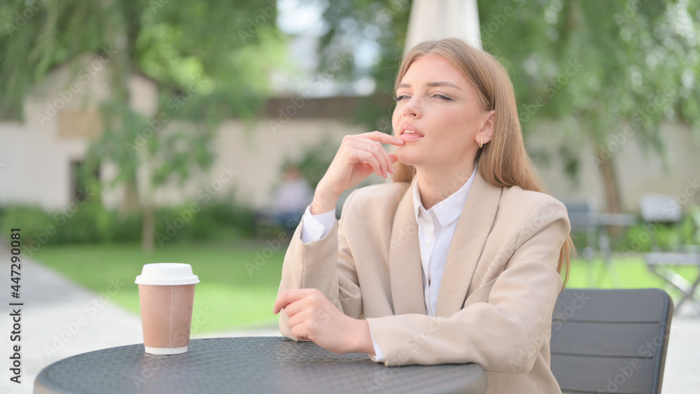 Businesswoman Thinking in Outdoor Cafe Businesswoman Thinking in Outdoor Cafe