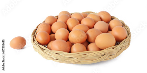 Fresh eggs in the basket isolated on white background