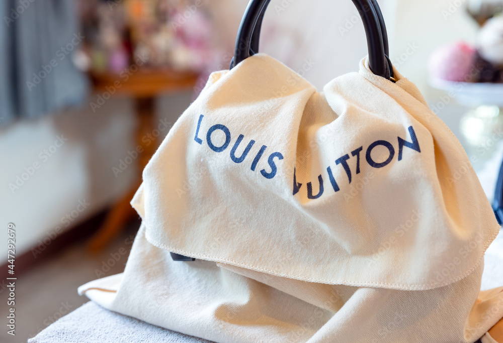 July 26, 2021: Nakhon Prathom, THAILAND, On the table is a Louis Vuitton bag,  as well