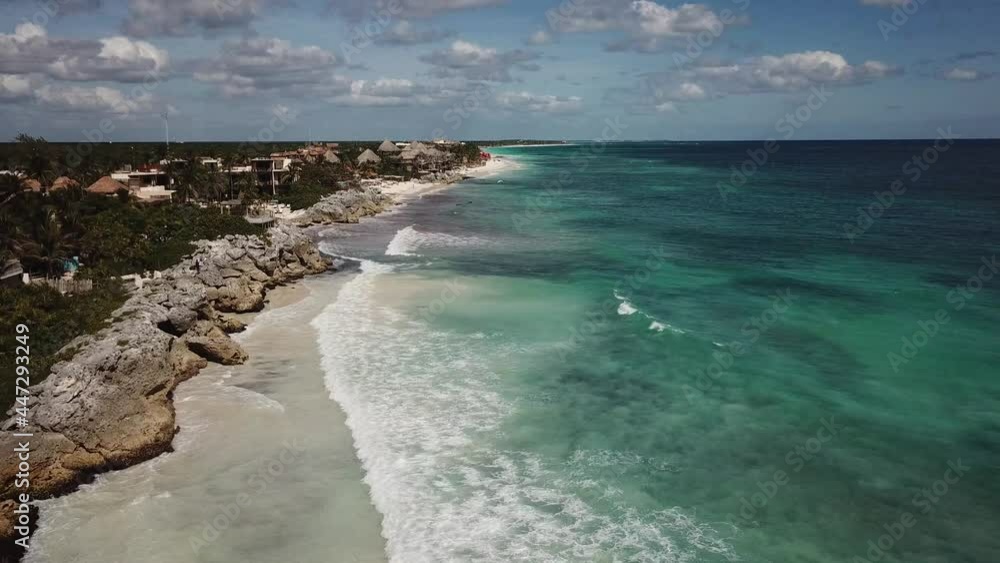 DLOG FLAT Aerial drone view of ruins in coastal Mayan city of Tulum, lush jungle, beach and crystal clear waters of Caribbean Sea - Yucatan Peninsula, Mexico from above, 4k UHD