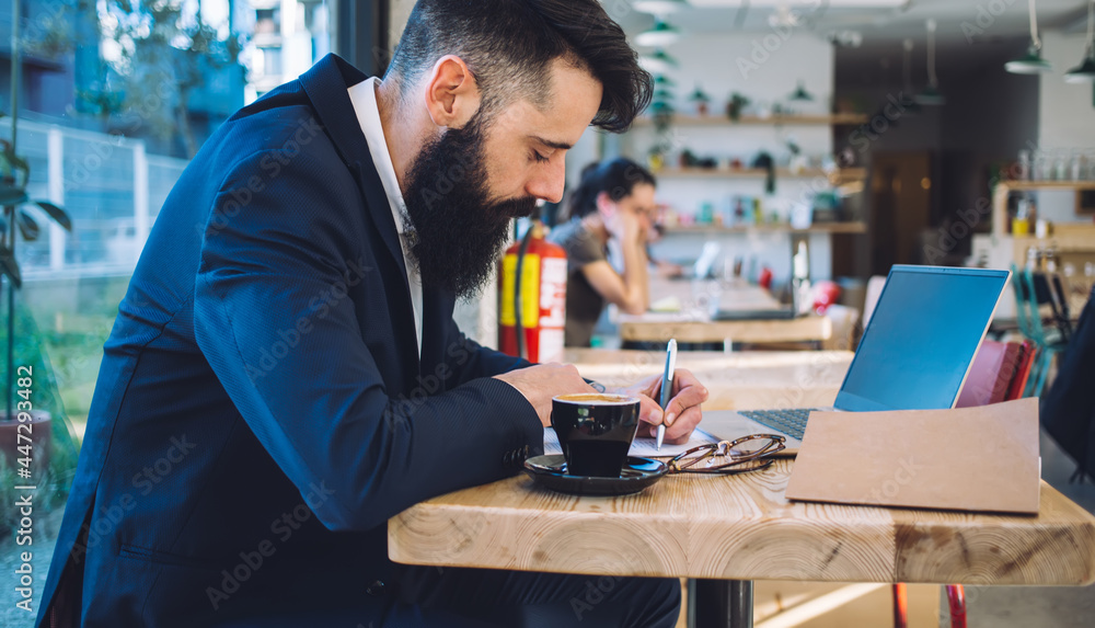 Busy man working remotely in cafe Busy man working remotely in cafe