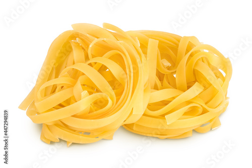 Raw tagliatelle pasta isolated on white background with clipping path and full depth of field