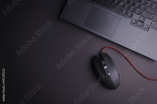 Wallpaper Mural Above photo of laptop keyboard and computer game mouse isolated on the black background with empty space Torontodigital.ca