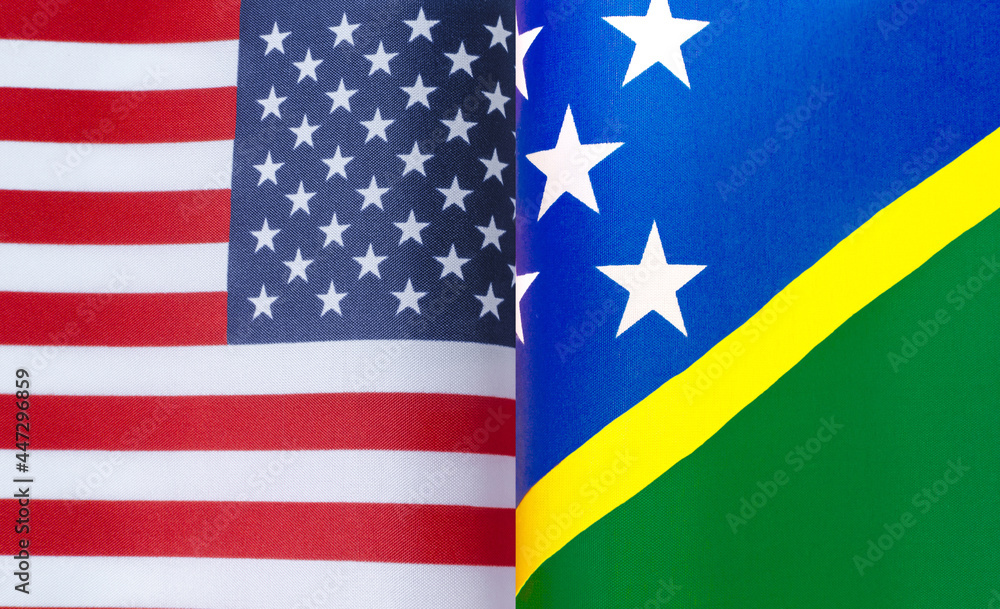 fragments of the national flags of the United States and the Solomon Islands close-up fragments of the national flags of the United States and the Solomon Islands close-up