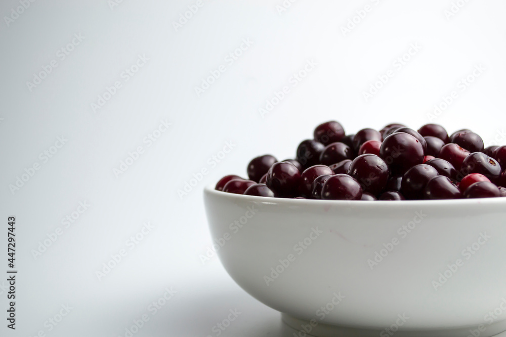 Cherry on a white background, juicy cherry for a photo wallpaper in your kitchen. Cherry on a white background, juicy cherry for a photo wallpaper in your kitchen.
