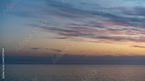 seascape with a beautiful sunset on the background of the sea