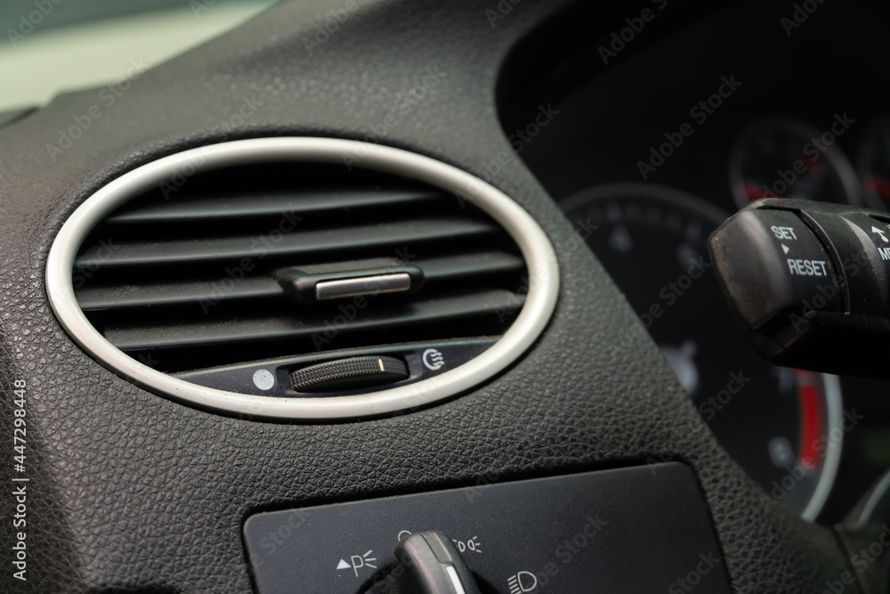 Close-up of the air conditioner in the car, the interior of the car