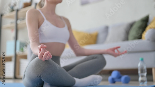Fototapeta Naklejka Na Ścianę i Meble -  Close up Woman Meditating on Yoga Mat at Home