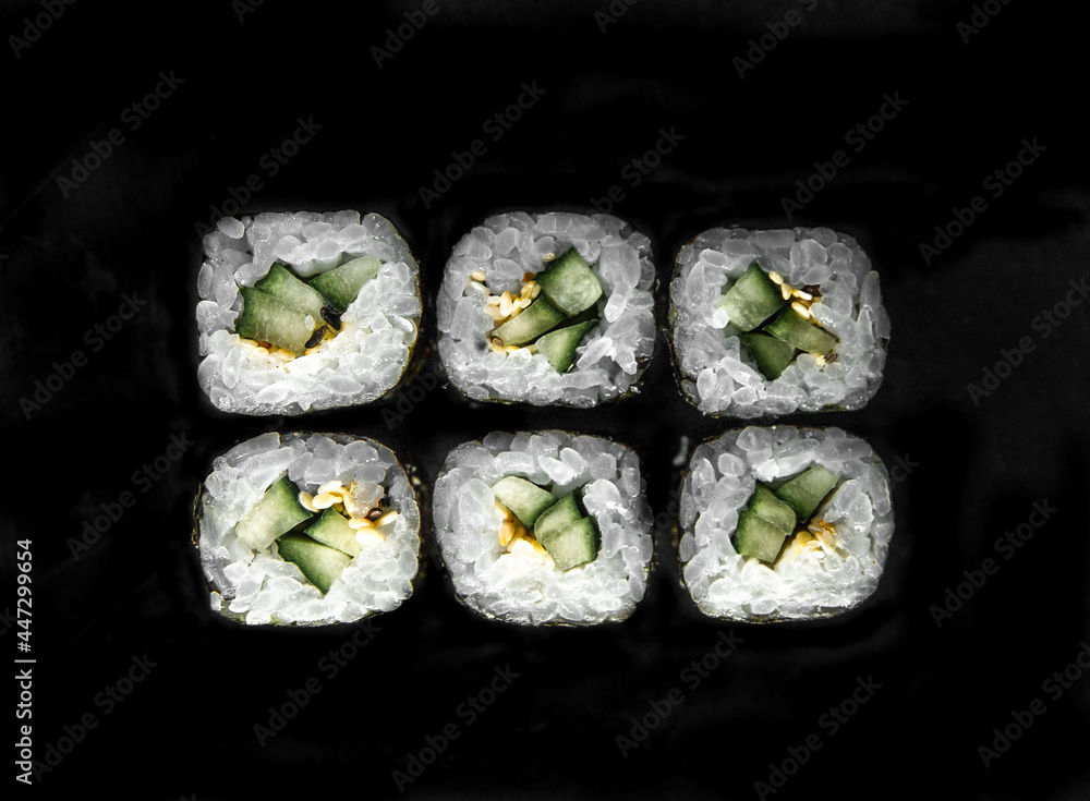 Photo for the menu. japanese rolls with cucumber top view Photo for the menu. japanese rolls with cucumber top view