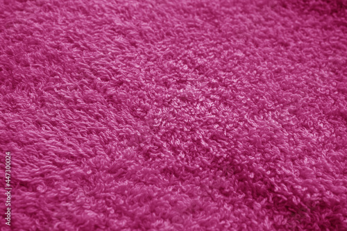 Bath towel texture with blur effect in pink tone.