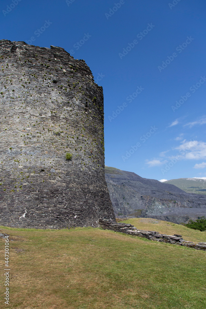 Dolbadarn Castle in Llanberis, Gwynedd,  North Wales.  Medieval castle on a hill with a blue sky
