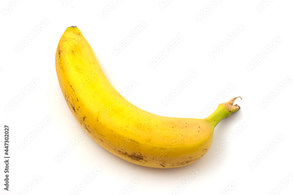 Banana with black spots isolated on white background. Overripe banana.