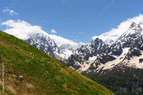 Great nature mountain landscapes. High mountains under snow. Scenic View Of Mountains Against Blue Sky. © STOCKIMAGE