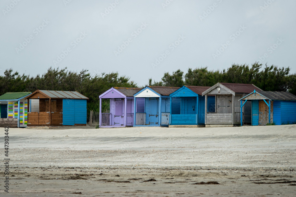 Naklejka premium rustic beach huts on the sand at The Witterings in England