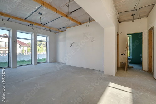 Wallpaper Mural Empty unfurnished room with minimal preparatory repairs. interior with white walls and drywall Torontodigital.ca