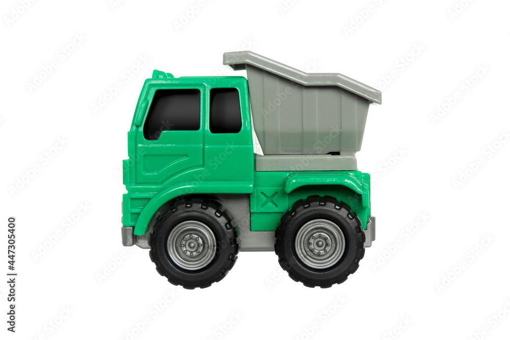 Toy dump truck for kids to enhance their learning Green truck with gray tray isolated on withe background with clipping path
