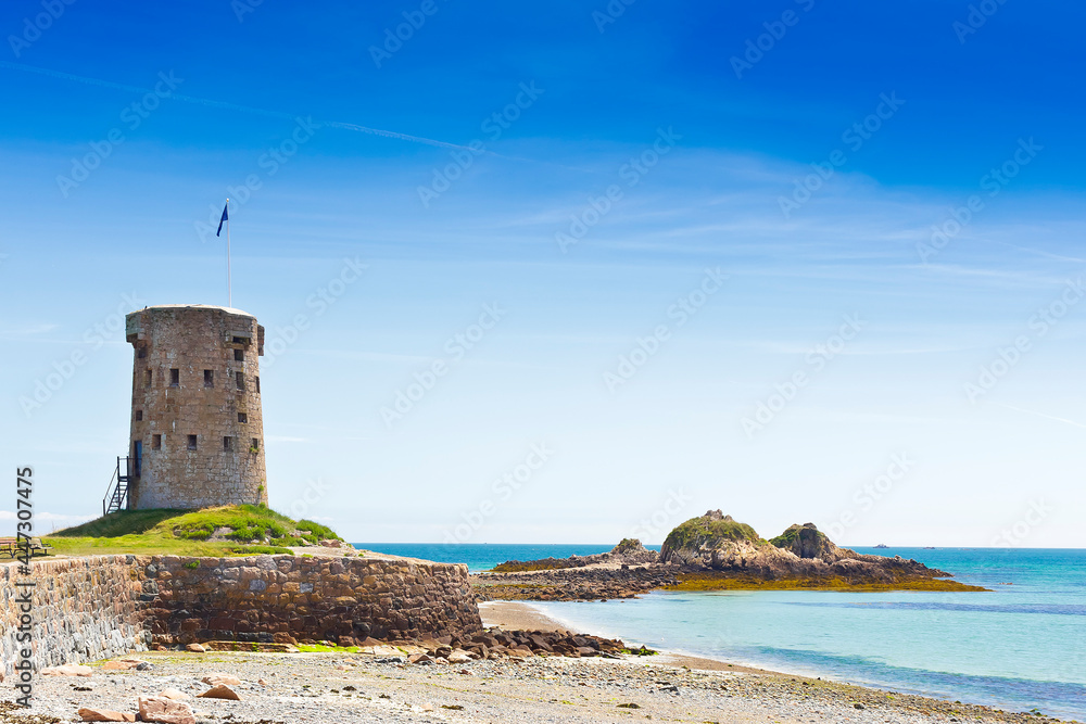 Le Hocq Tower and Common on the south shore of Jersey, Channel Islands, Britain, on a sunny summer day.