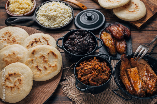  Table served with Venezuelan breakfast, arepas with different types of fillings photo