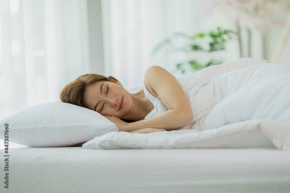 Beautiful Attractive Asian woman sleep and sweet dream lying on bed in cozy bedroom in the morning,Young girl sleep on bed relax and comfortable,Sleep and Rest Healthcare Concept Beautiful Attractive Asian woman sleep and sweet dream lying on bed in cozy bedroom in the morning,Young girl sleep on bed relax and comfortable,Sleep and Rest Healthcare Concept