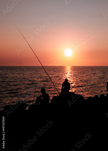 fishing at sunset