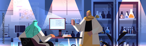 arab researchers team working on computer and making chemical experiments in laboratory molecular engineering
