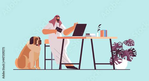 arab man with credit card using laptop online shopping concept